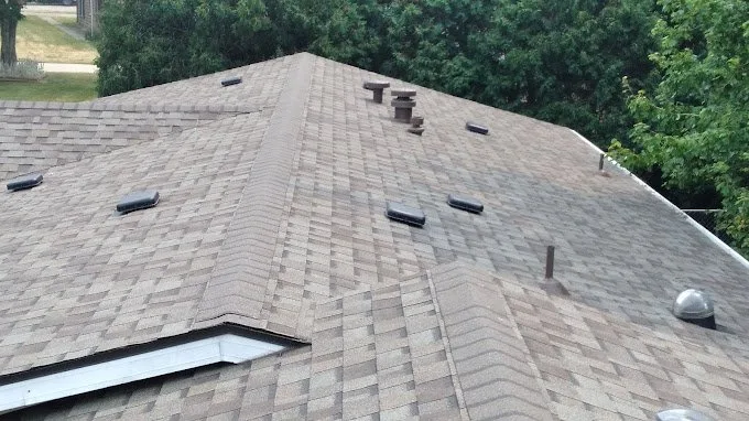 Repaired shingle roof with new flashing and vents