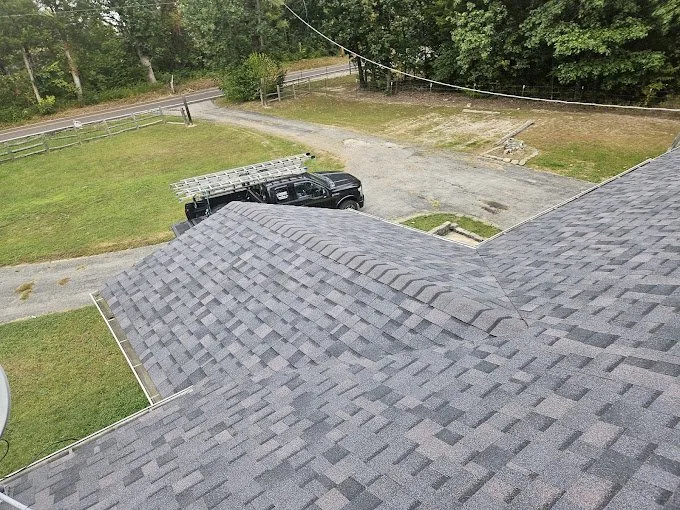 New architectural shingle roof installed by American Roofing & Exteriors