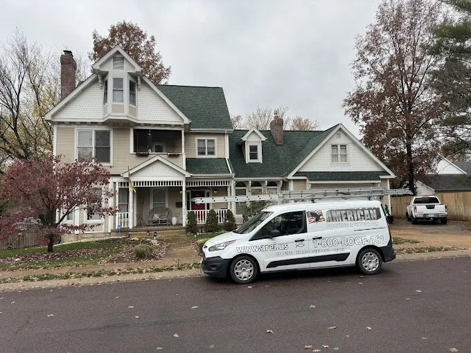 American Roofing & Exteriors van at a completed St. Louis project