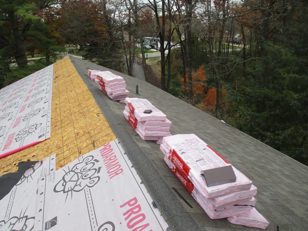 Shingle bundles staged on a roof ready for installation